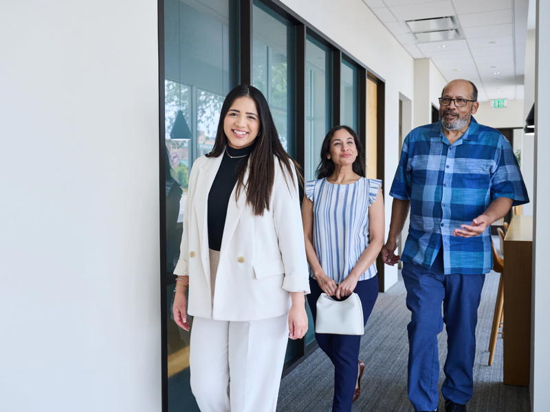 a group of people walking in a hallway