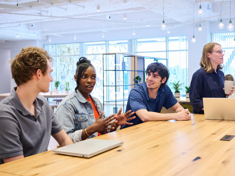 a group of people sitting around a table